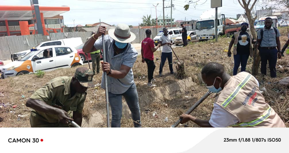 THE MUNICIPAL CHIEF EXECUTIVE OF GA SOUTH, HON. MOSES KABU KUBI OCANSEY, LEADS CLEAN-UP EXERCISE AT TOLL BOOTH, TUBA JUNCTION

